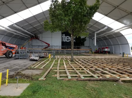 Temporary Structure with Flooring Being Set
